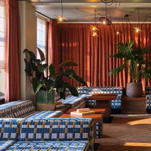 The lobby seating area at The Hoxton Lloyd Amsterdam, with tons of natural light.