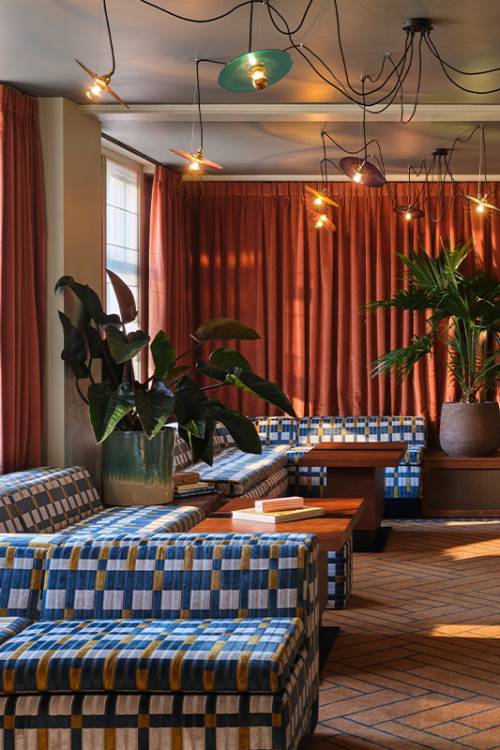 The lobby seating area at The Hoxton Lloyd Amsterdam, with tons of natural light.